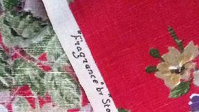 Vintage curtains blue and yellow roses on red background